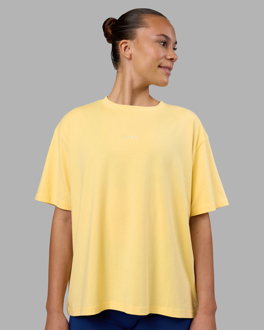 Woman wearing Go-To FLXCotton Oversized Tee - Lemon-White | Model:Charlize | Size:S