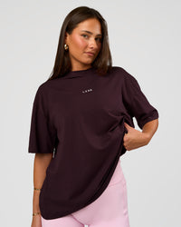 Woman wearing Go-To FLXCotton Oversized Tee - Midnight Plum-White | Model:Bianca | Size:S