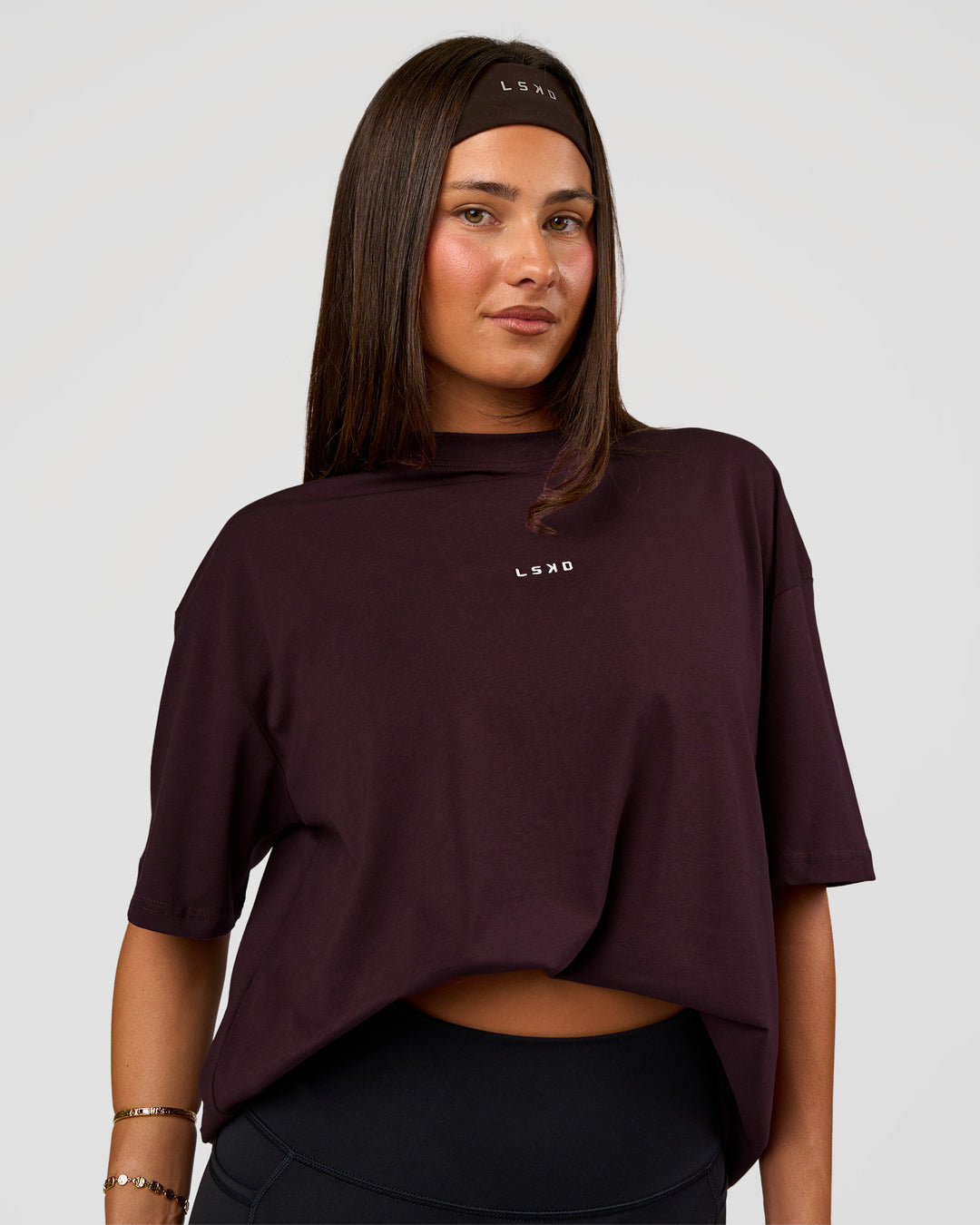 Woman wearing Go-To FLXCotton Oversized Tee - Midnight Plum-White | Model:Bianca | Size:S