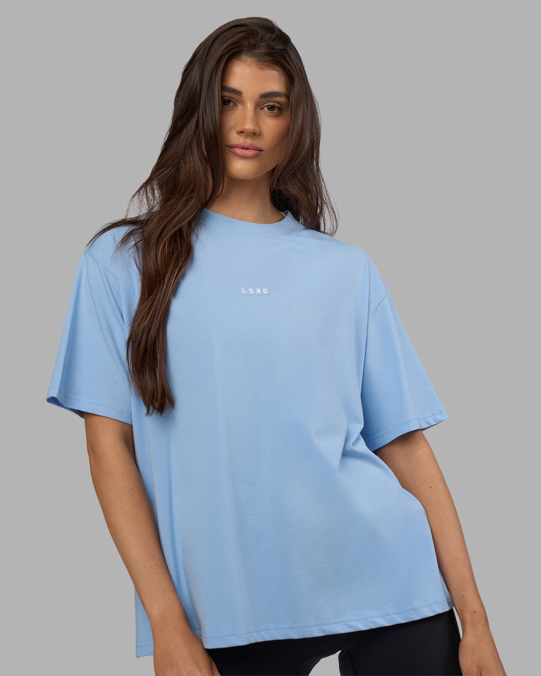 Woman wearing Go-To FLXCotton Oversized Tee - Open Air-White | Model:Phoebe | Size:S