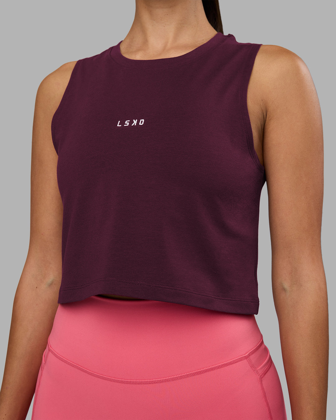 Woman wearing Go-To FLXCotton Tank - Cherry Lacquer-White | Model:Rhiley | Size:S