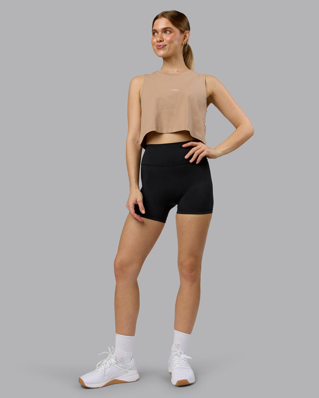 Woman wearing Go-To FLXCotton Tank - Warm Smoke-White | Model:Emilie | Size:S