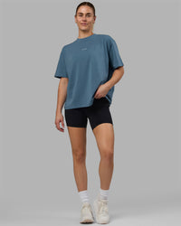Woman wearing Go-To FLXCotton Oversized Tee - Elemental Blue-White