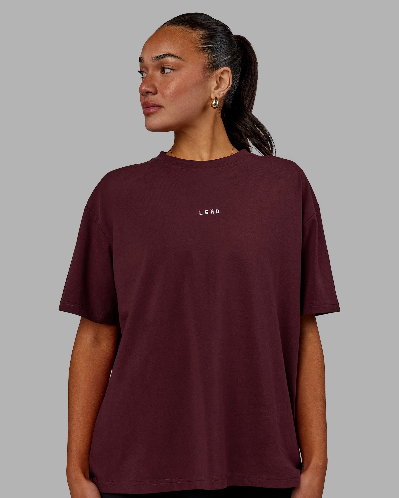 Woman wearing Go-To FLXCotton Oversized Tee - Cherry Lacquer-White | Model:Kirstyn | Size:S