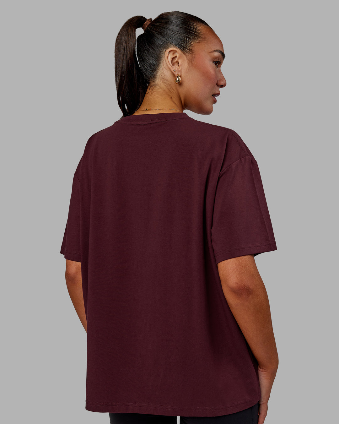 Woman wearing Go-To FLXCotton Oversized Tee - Cherry Lacquer-White | Model:Kirstyn | Size:S