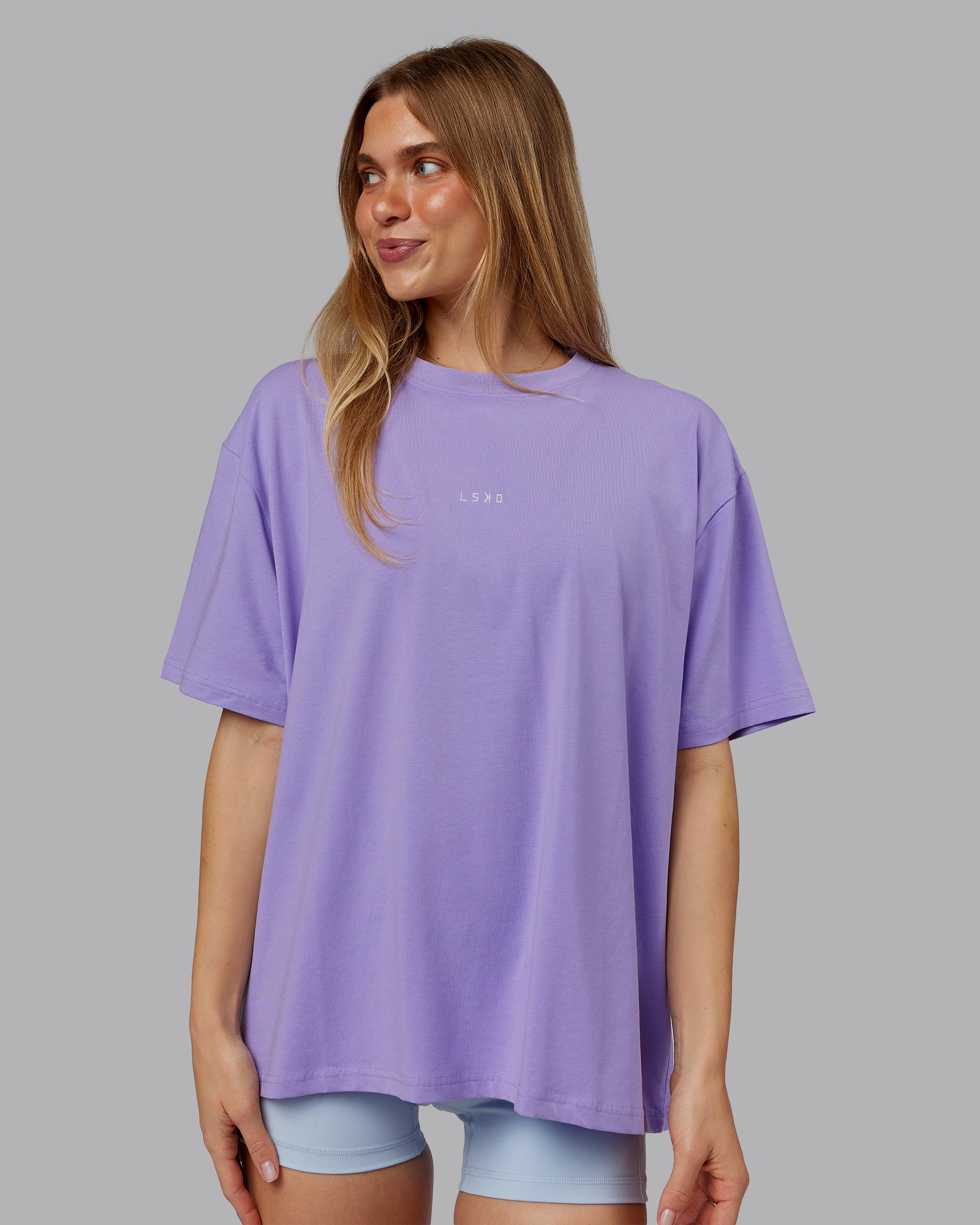 Woman wearing Go-To FLXCotton Oversized Tee - Violet Ray-White | Model:Emilie | Size:S