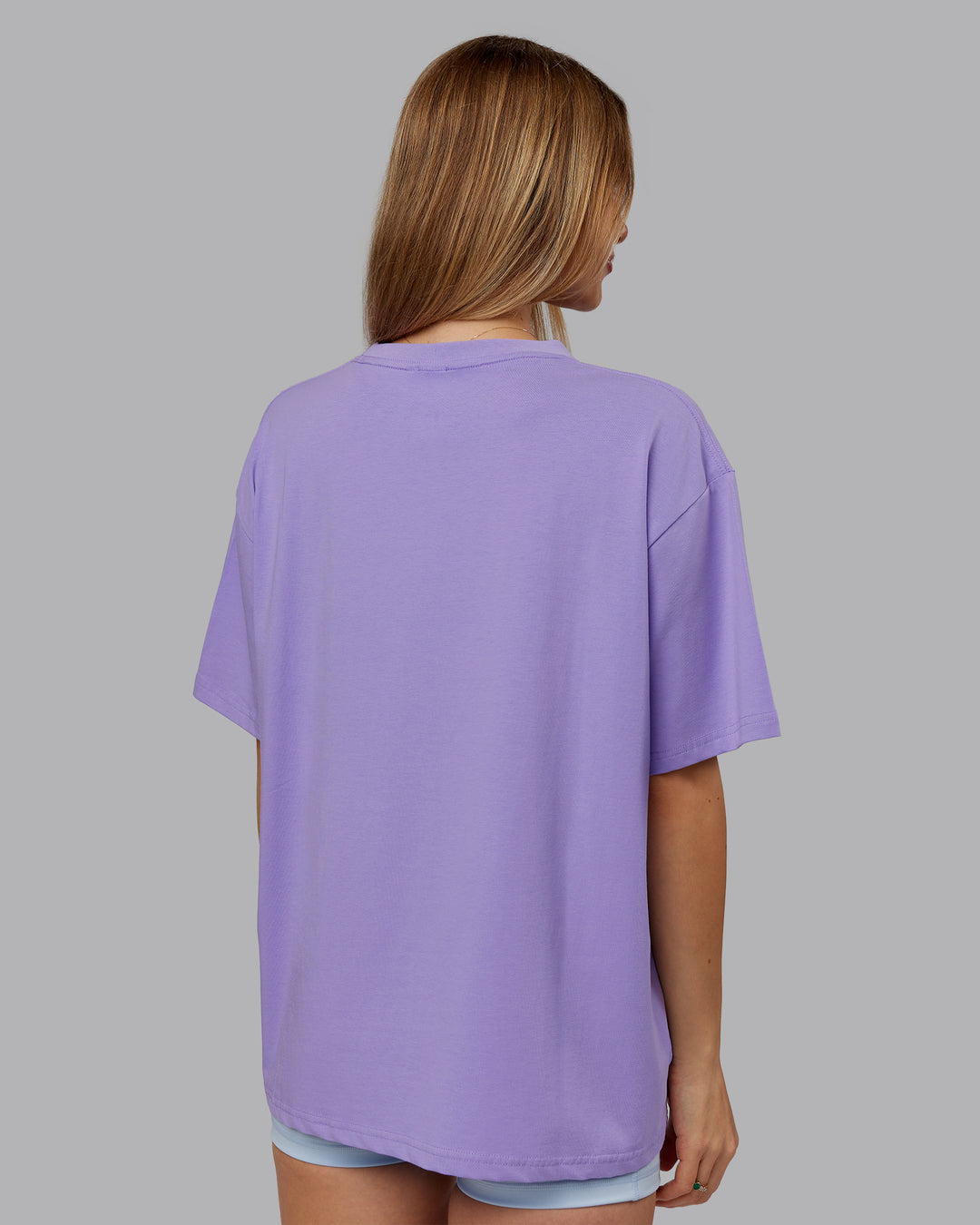 Woman wearing Go-To FLXCotton Oversized Tee - Violet Ray-White | Model:Emilie | Size:S