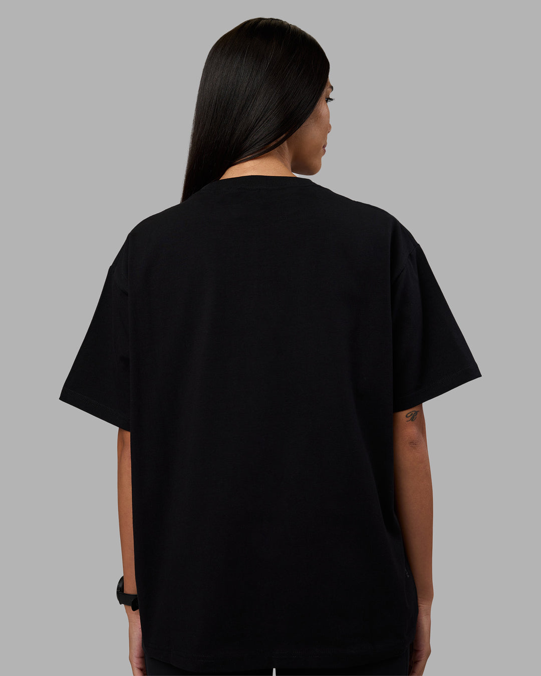 Woman wearing Go-To Heavyweight Oversized Tee - Black | Model:Rhiley | Size:S