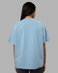 Woman wearing Go-To Heavyweight Oversized Tee - Glacier Lake | Model:Rhiley | Size:S