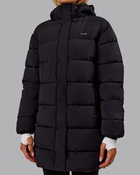 Woman wearing Go-To Puffer Long Jacket - Black | Model:Ella | Size:S
