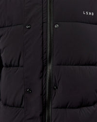 Woman wearing Go-To Puffer Long Jacket - Black | Model:Ella | Size:S