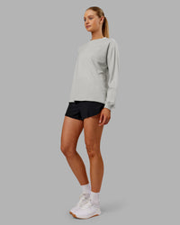 Woman wearing Go-To Long Sleeve FLXCotton Oversized Tee - Digital Mist-White | Model:Ella| Size:S