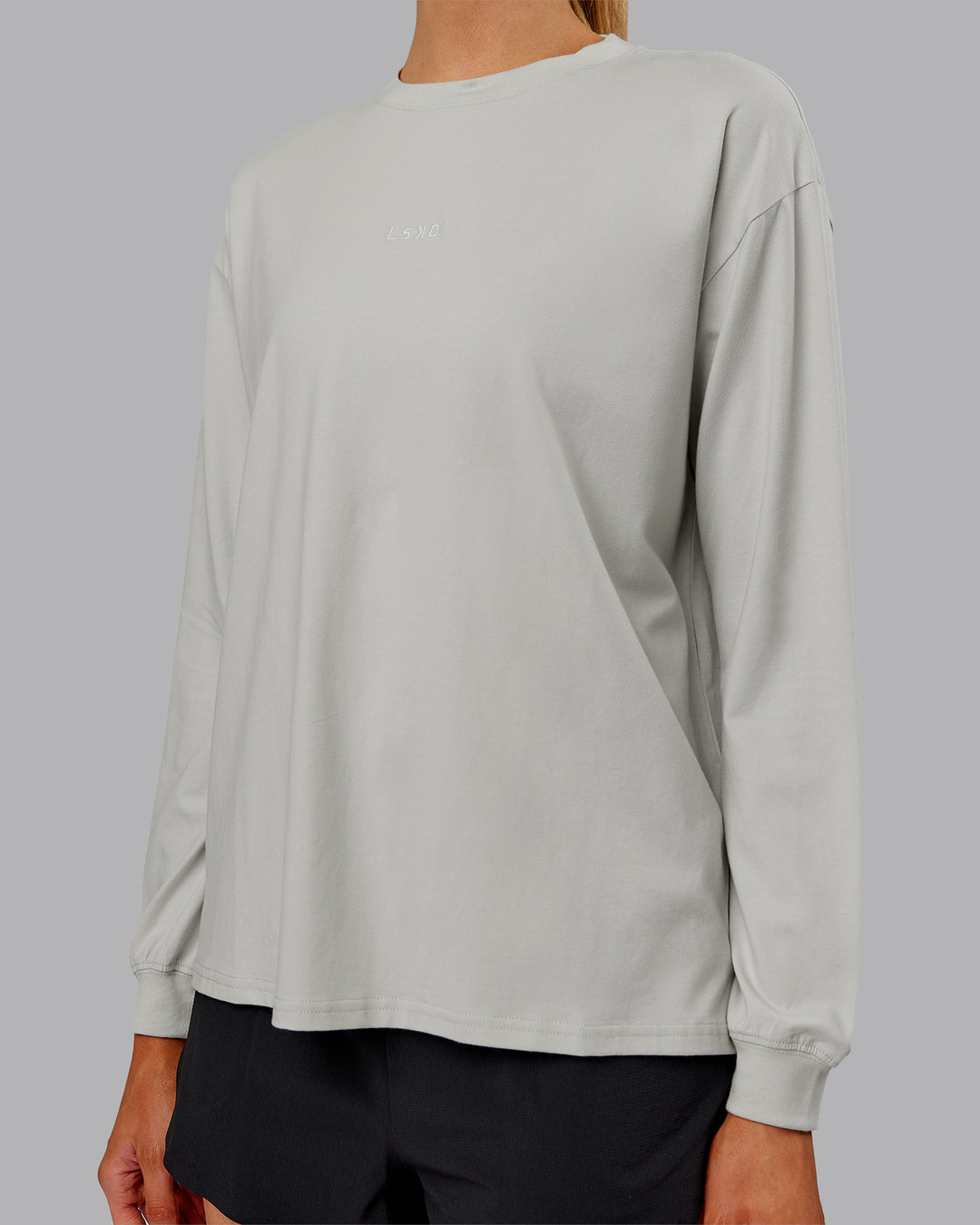 Woman wearing Go-To Long Sleeve FLXCotton Oversized Tee - Digital Mist-White | Model:Ella| Size:S