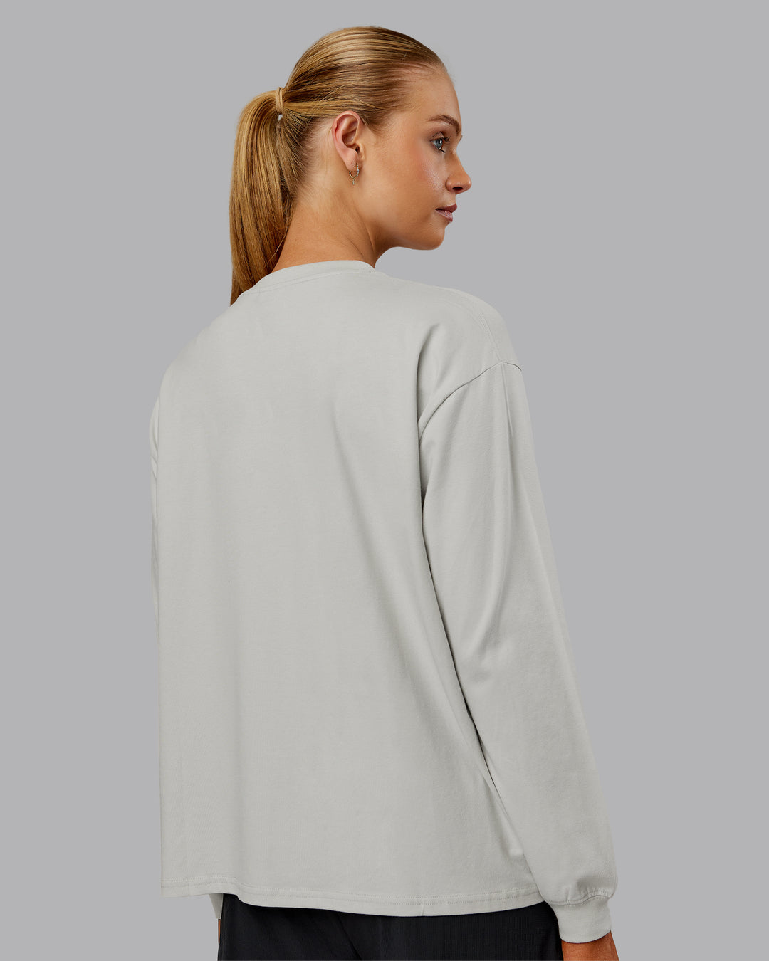 Woman wearing Go-To Long Sleeve FLXCotton Oversized Tee - Digital Mist-White | Model:Ella| Size:S