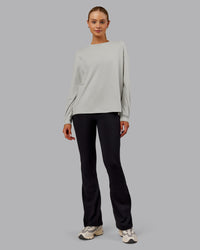 Woman wearing Go-To Long Sleeve FLXCotton Oversized Tee - Digital Mist-White | Model:Ella| Size:S