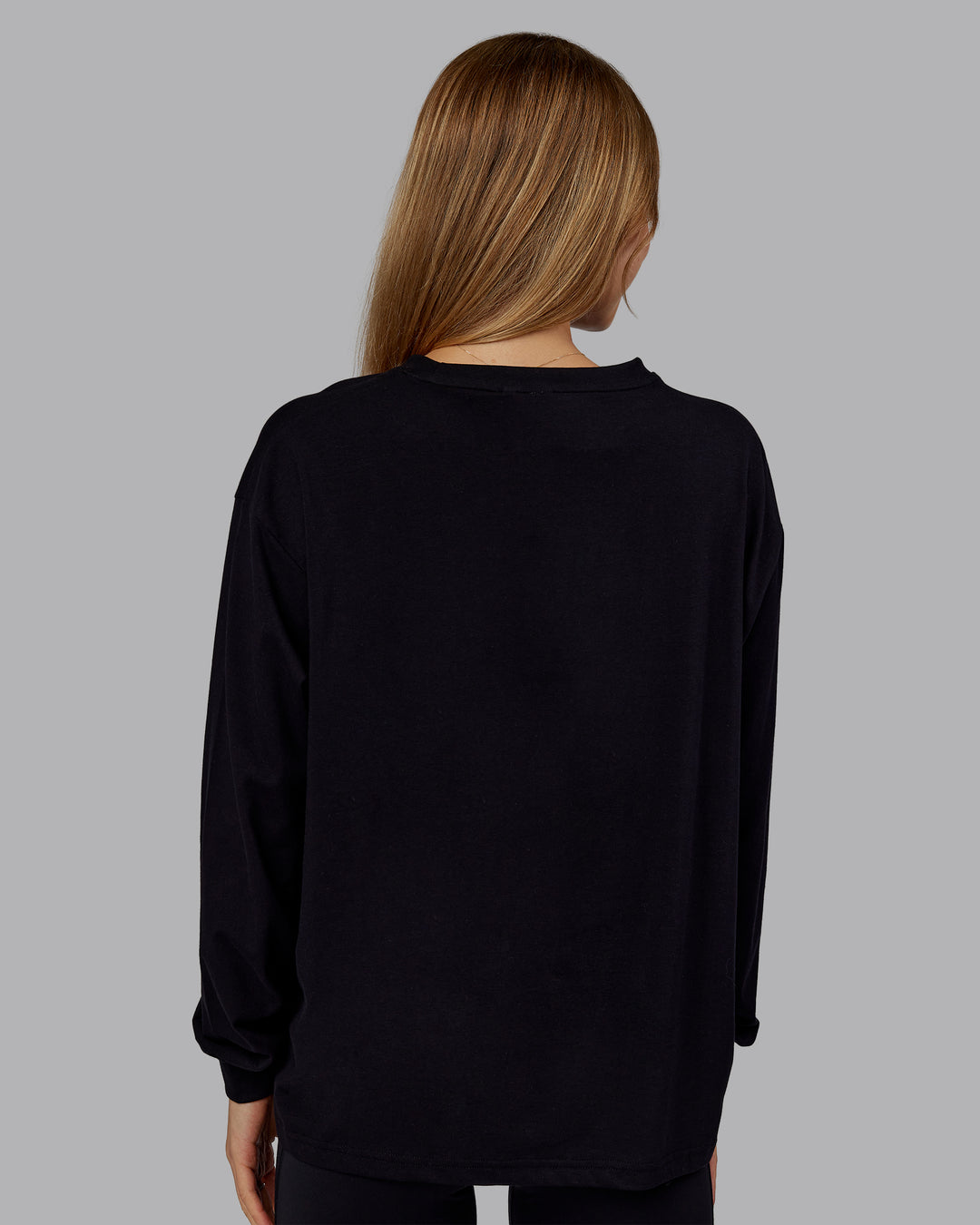 Woman wearing Go-To Long Sleeve FLXCotton Oversized Tee - Black-White | Model:Emilie | Size:S