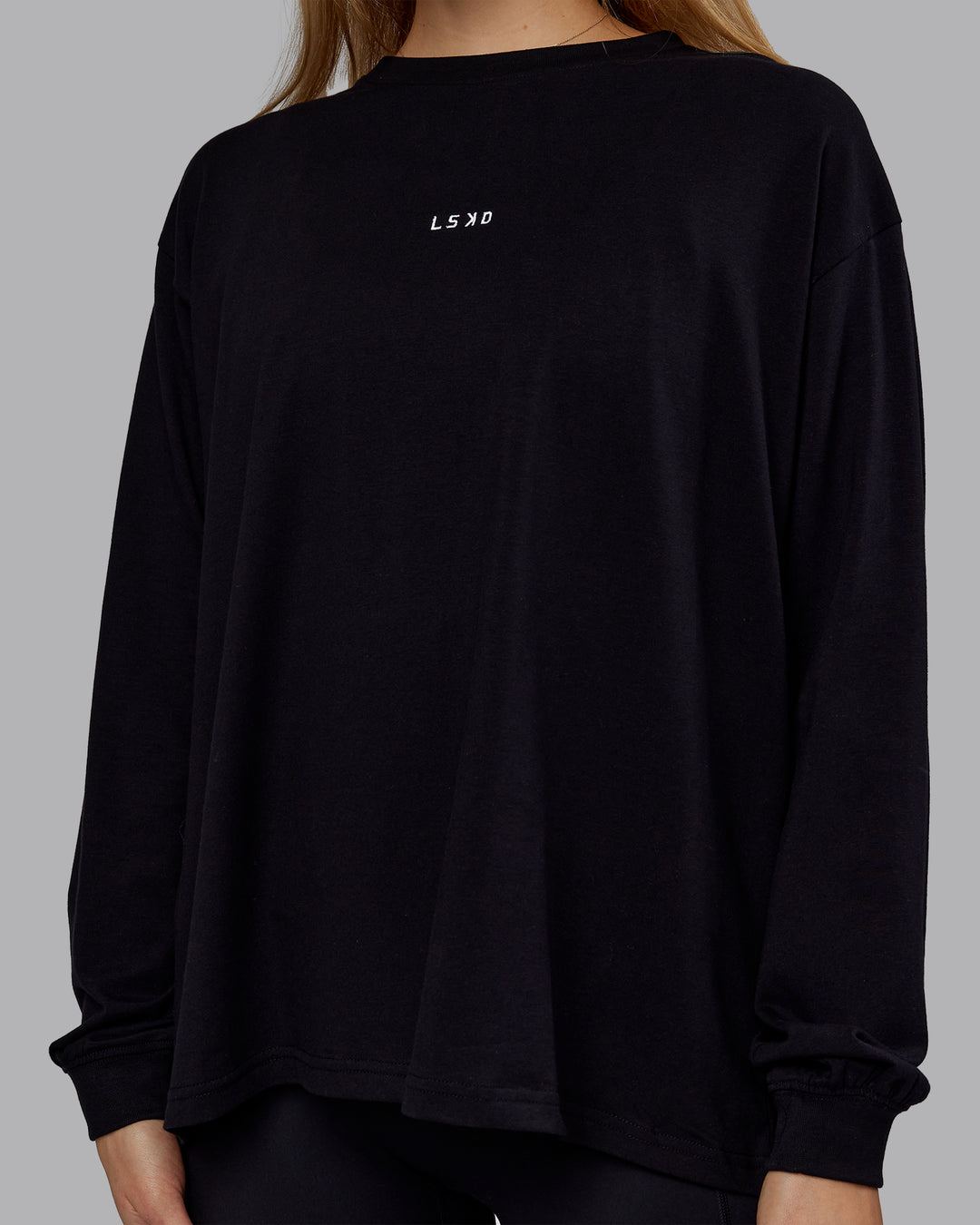 Woman wearing Go-To Long Sleeve FLXCotton Oversized Tee - Black-White | Model:Emilie | Size:S