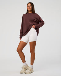 Woman wearing Go-To Long Sleeve FLXCotton Oversized Tee - Cocoa Powder-White | Model:Bianca | Size:S