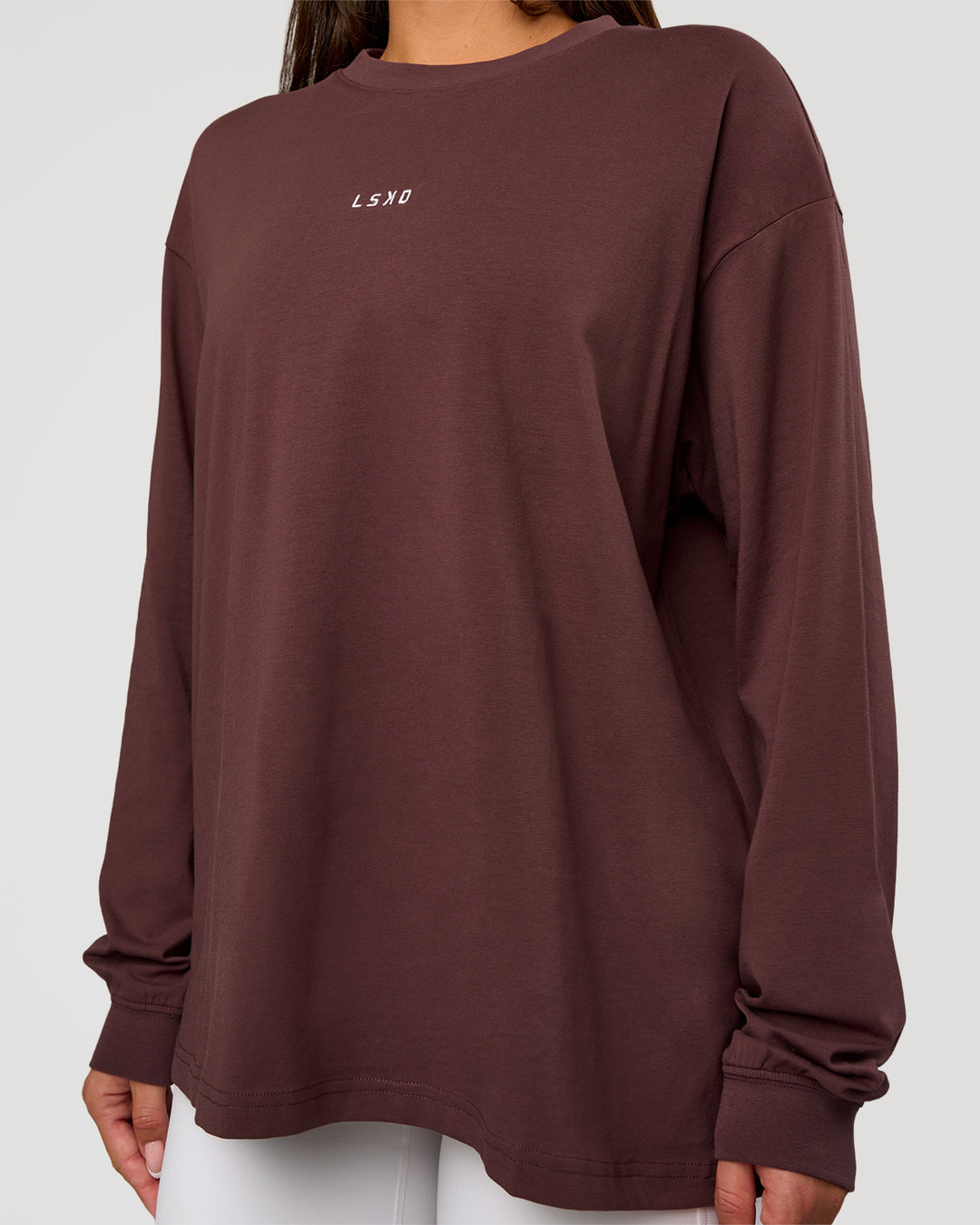 Woman wearing Go-To Long Sleeve FLXCotton Oversized Tee - Cocoa Powder-White | Model:Bianca | Size:S