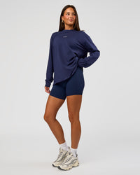 Woman wearing Go-To Long Sleeve FLXCotton Oversized Tee - Future Navy-White | Model:Bianca | Size:S