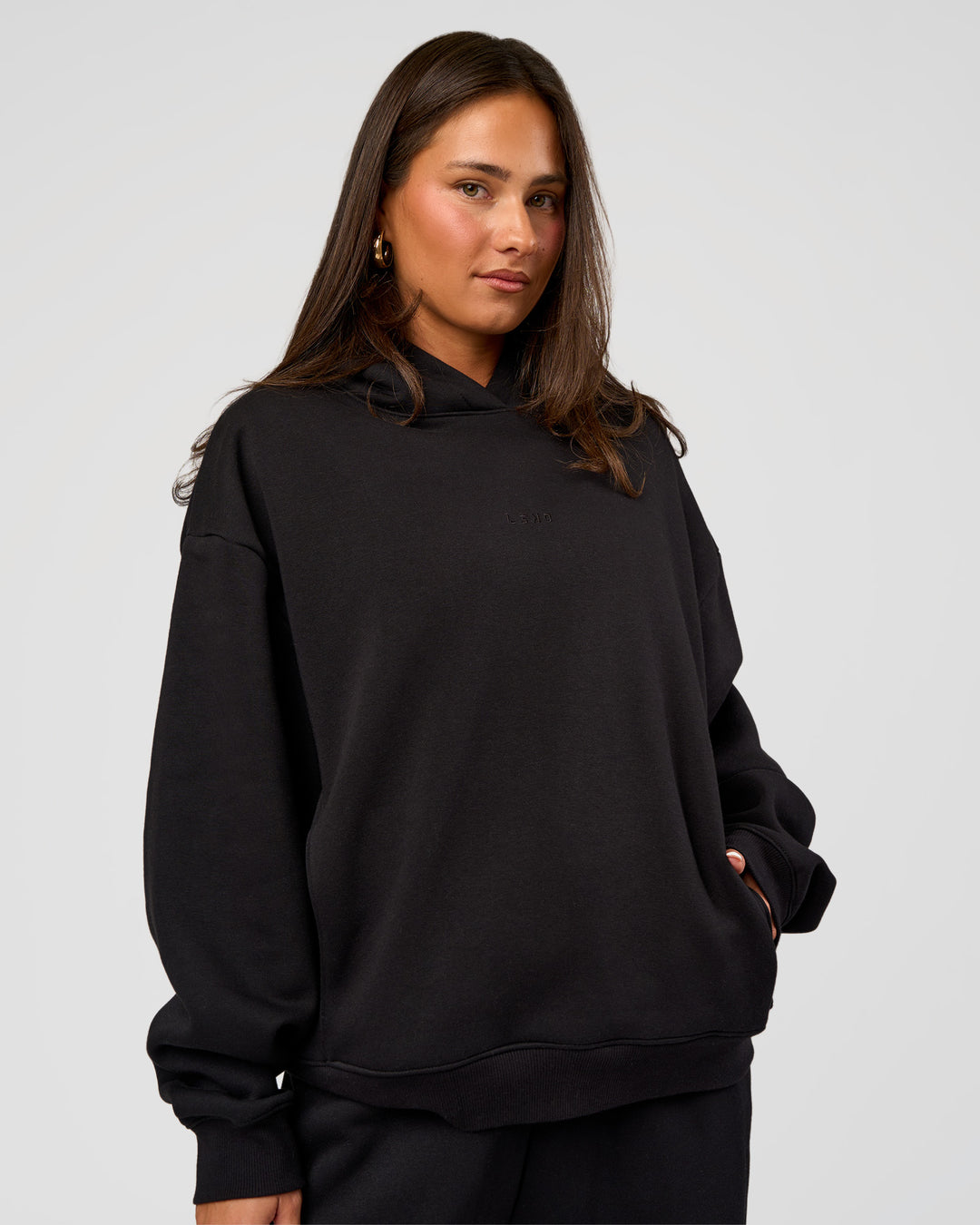 Woman wearing Go-To Oversized Hoodie - Black | Model:Bianca | Size:S