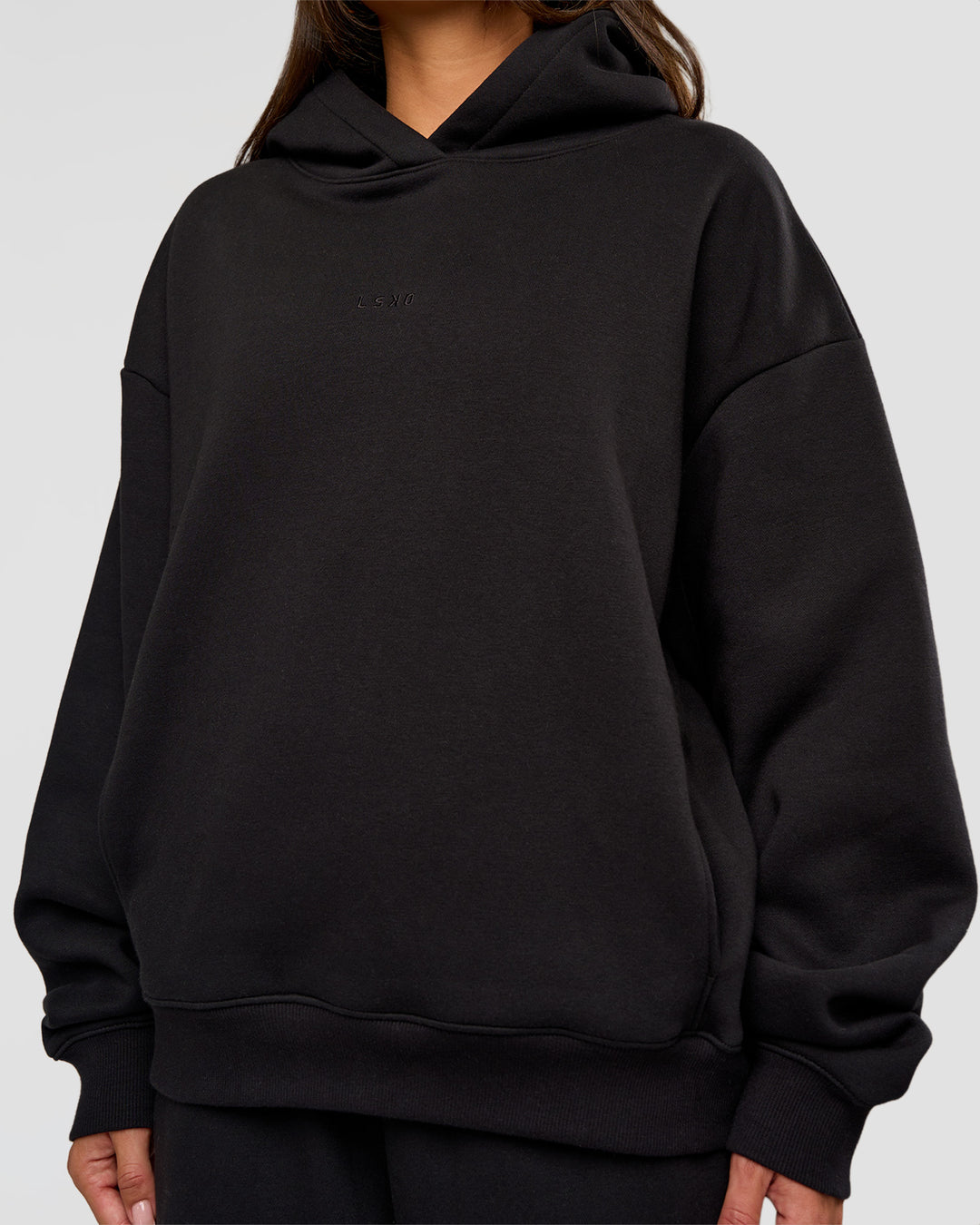 Woman wearing Go-To Oversized Hoodie - Black | Model:Bianca | Size:S
