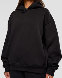 Woman wearing Go-To Oversized Hoodie - Black | Model:Bianca | Size:S