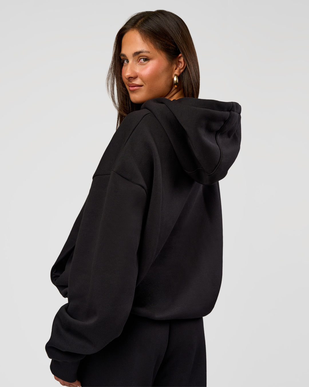 Woman wearing Go-To Oversized Hoodie - Black | Model:Bianca | Size:S
