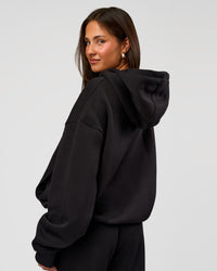 Woman wearing Go-To Oversized Hoodie - Black | Model:Bianca | Size:S