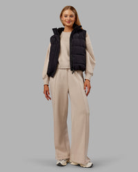 Woman wearing Go-To Puffer Vest - Black | Model:Ella | Size:S