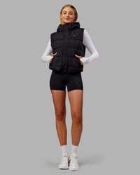 Woman wearing Go-To Puffer Vest - Black | Model:Ella | Size:S
