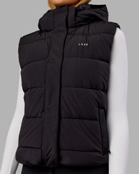 Woman wearing Go-To Puffer Vest - Black | Model:Ella | Size:S