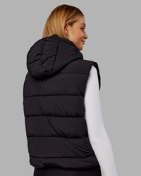 Woman wearing Go-To Puffer Vest - Black | Model:Ella | Size:S