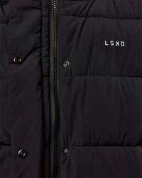 Woman wearing Go-To Puffer Vest - Black | Model:Ella | Size:S