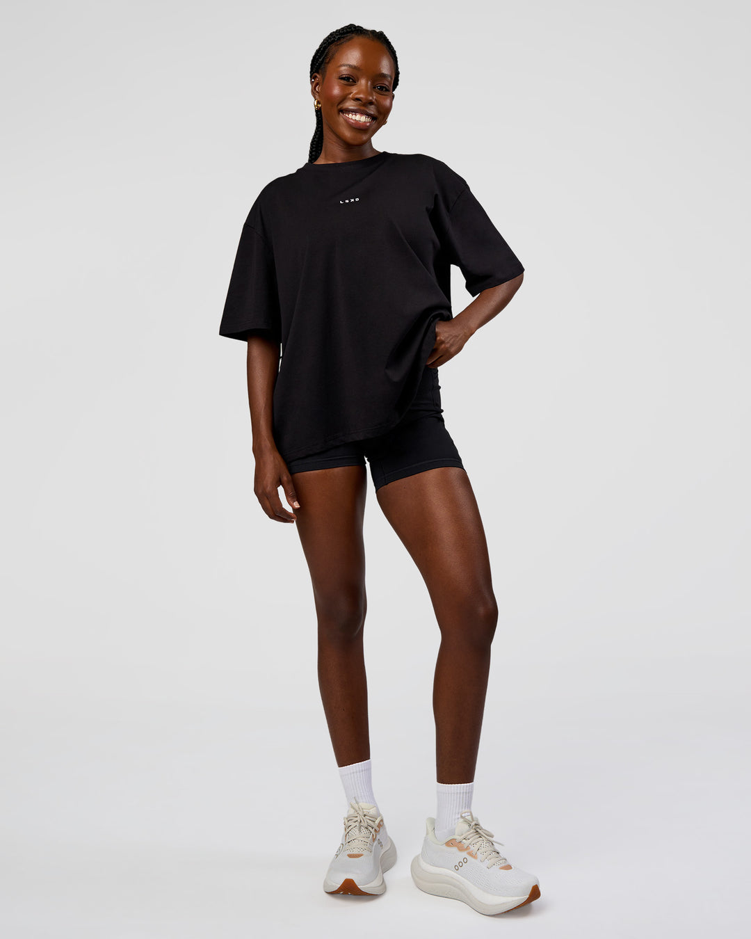 Woman wearing Go-To Run Club FLXCotton Oversized Tee - Black-Marshmallow | Model:Ellie | Size:S