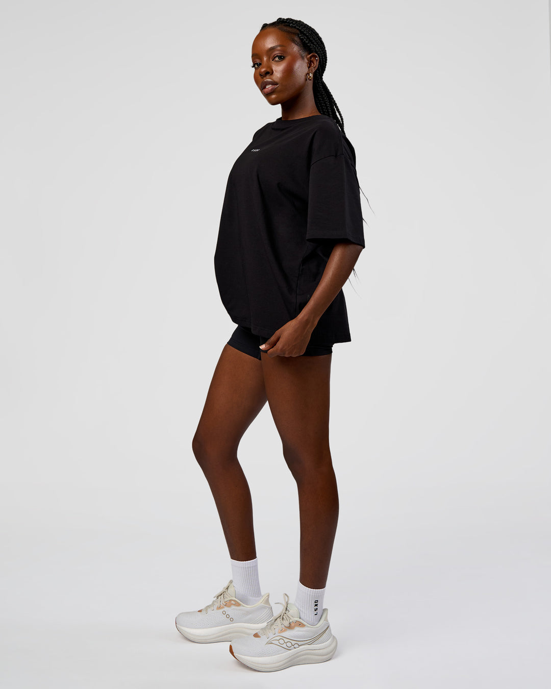 Woman wearing Go-To Run Club FLXCotton Oversized Tee - Black-Marshmallow | Model:Ellie | Size:S