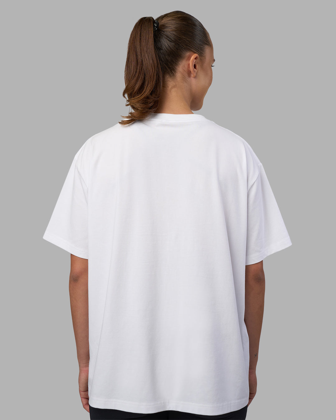 Woman wearing Go-To V-Neck FLXCotton Oversized Tee - White-Black | Model:Charlize | Size:S
