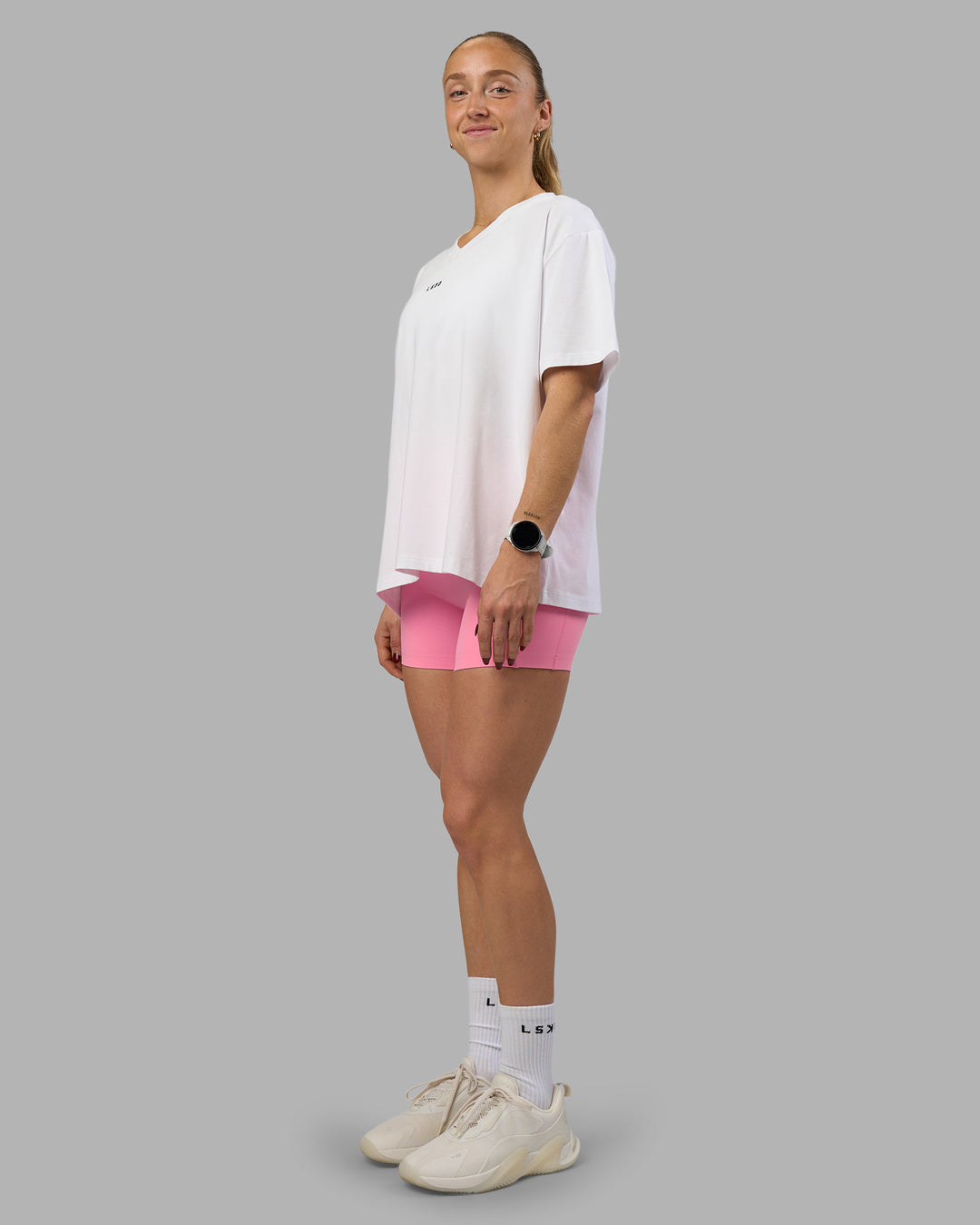 Woman wearing Go-To V-Neck FLXCotton Oversized Tee - White-Black | Model:Bronte | Size:S