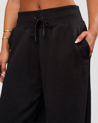Woman wearing Go-To Wide Leg Track Pant - Black | Model:Bianca | Size:S