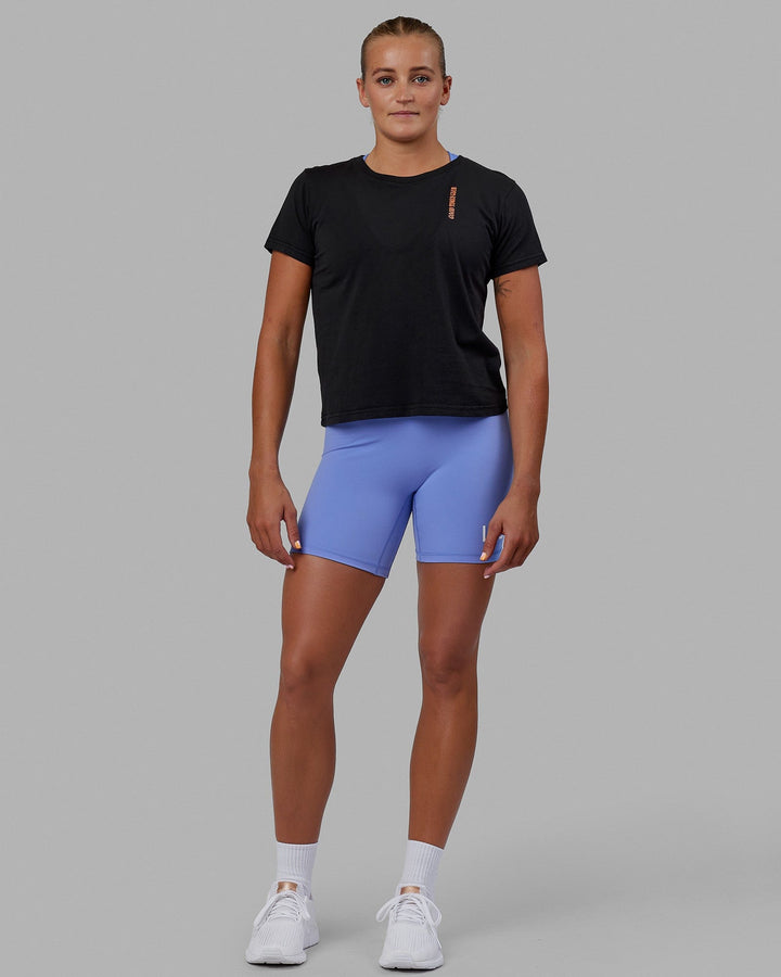 Woman wearing Good Times Global Tee - Black
