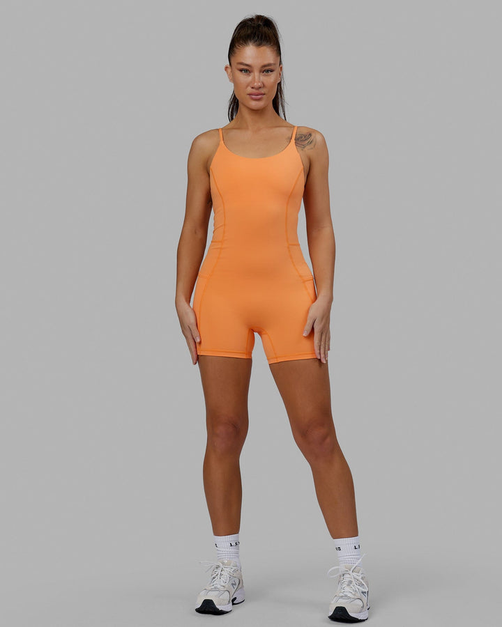 Woman wearing Helix Active Bodysuit - Tangerine