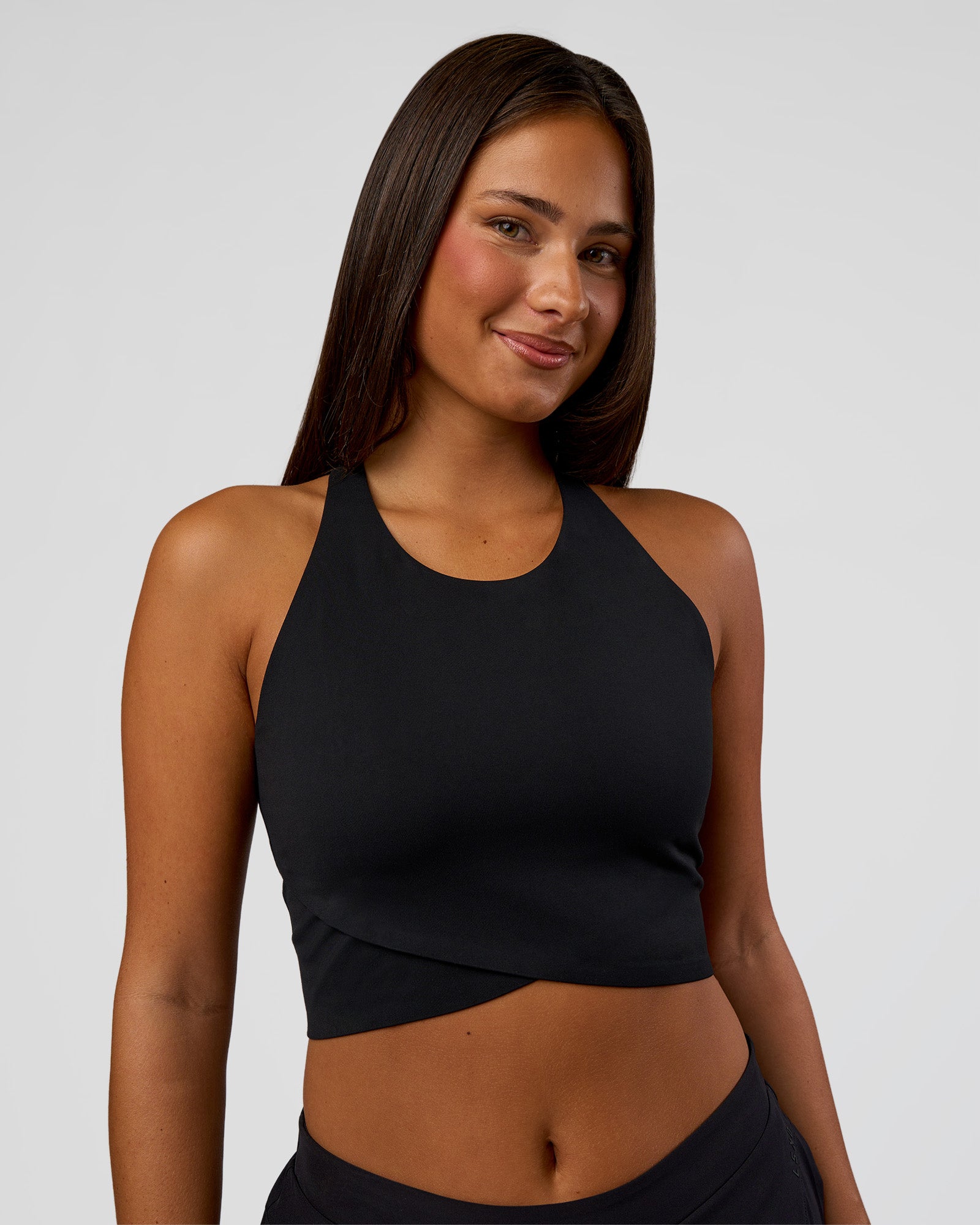 Woman wearing Hybrid Performance Crossover Tank - Black | Model:Bianca | Size:S
