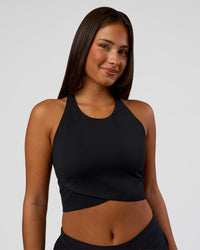 Woman wearing Hybrid Performance Crossover Tank - Black | Model:Bianca | Size:S
