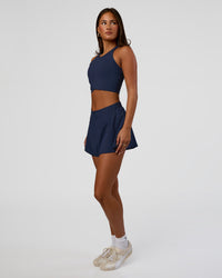 Woman wearing Hybrid Performance Crossover Tank - Future Navy | Model:Bianca | Size:S