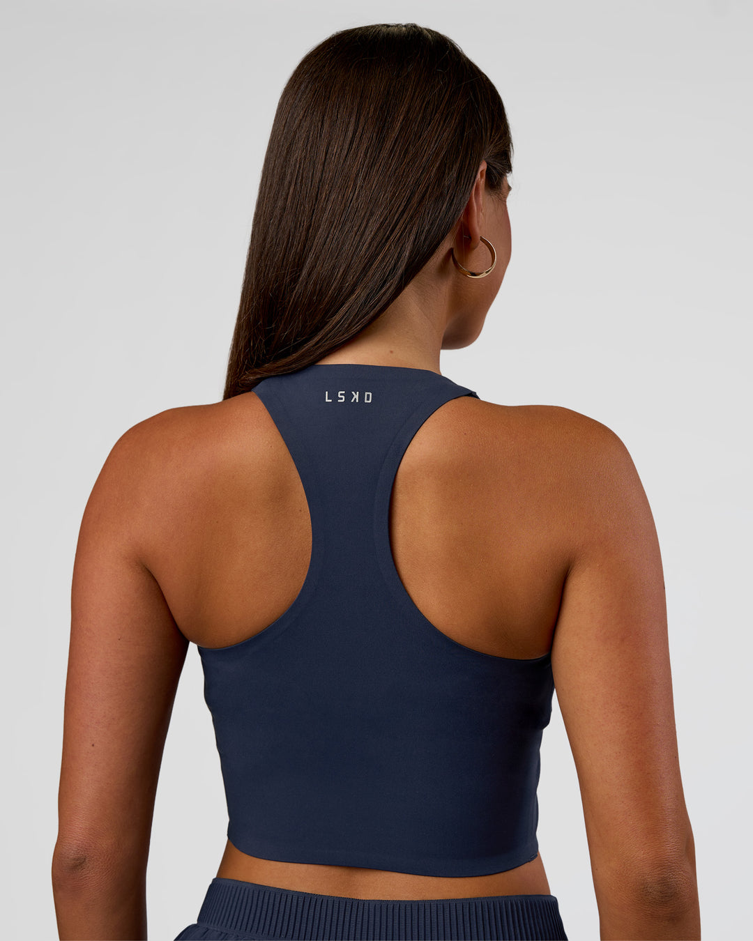 Woman wearing Hybrid Performance Crossover Tank - Future Navy | Model:Bianca | Size:S