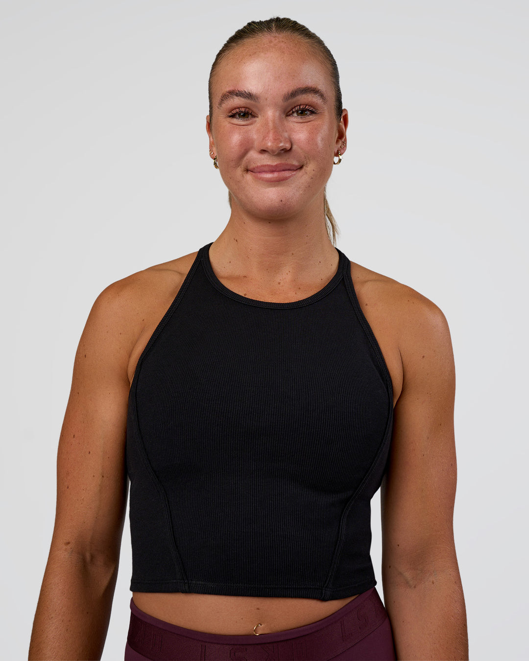 Woman wearing Ignite High Neck Tank - Black | Model:Sav | Size:S