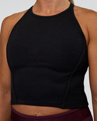 Woman wearing Ignite High Neck Tank - Black | Model:Sav | Size:S
