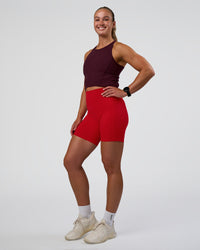Woman wearing Ignite High Neck Tank - Cherry Lacquer | Model:Sav | Size:S