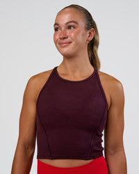 Woman wearing Ignite High Neck Tank - Cherry Lacquer | Model:Sav | Size:S