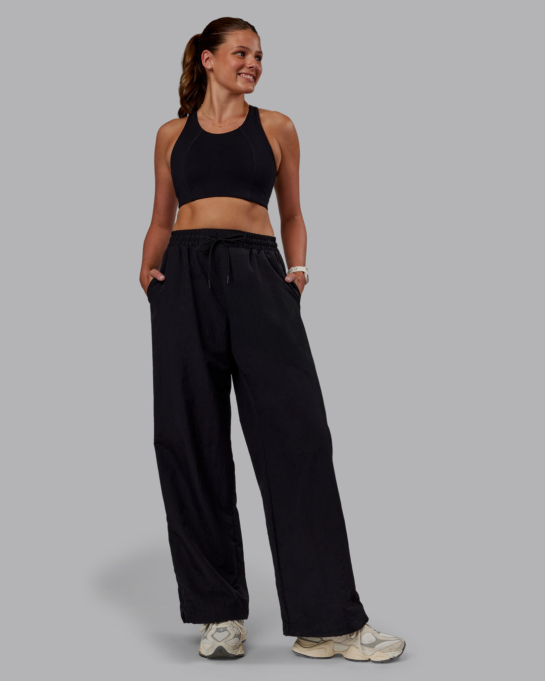 Woman wearing Ignite Parachute Pant - Black | Model:Phoebe | Size:S